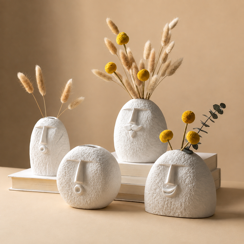 Abstract face vases with pampas grass and yellow flowers