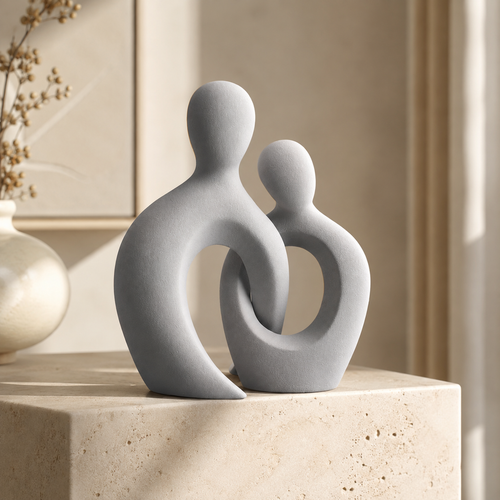 Abstract couple sculpture on marble surface