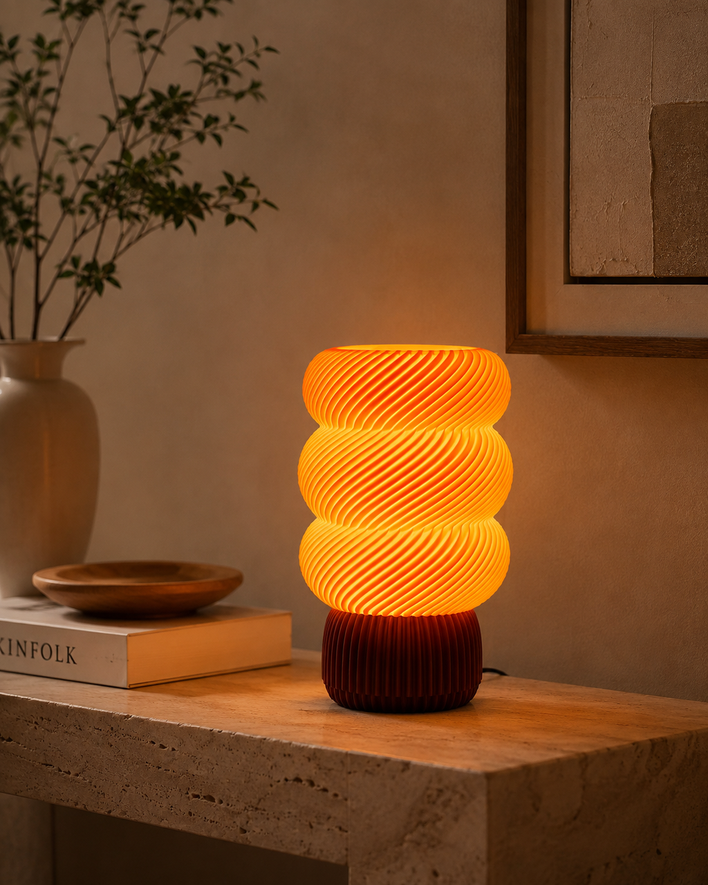 Spiral wave lamp on travertine console with warm golden glow