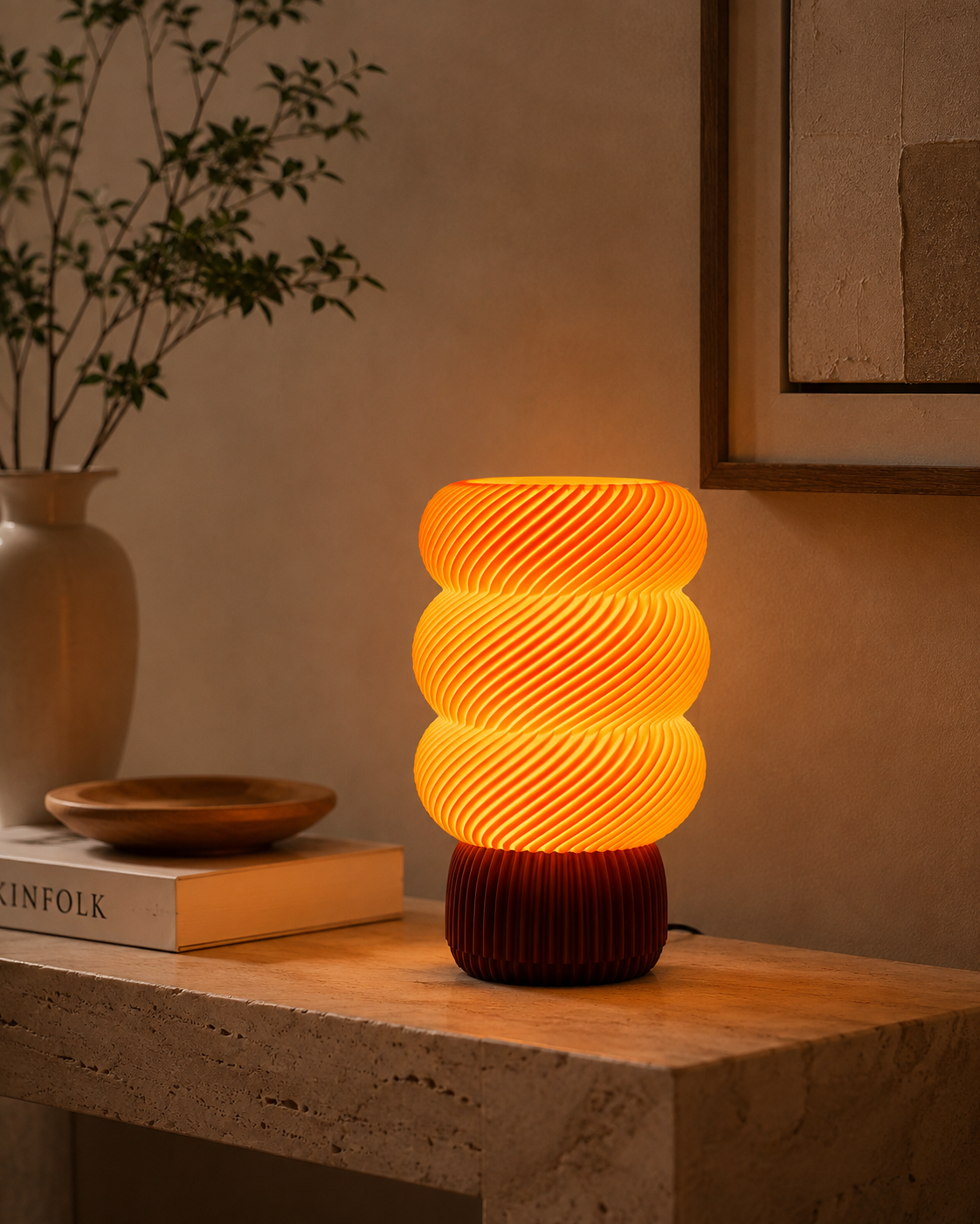 Spiral wave lamp on travertine console with warm golden glow